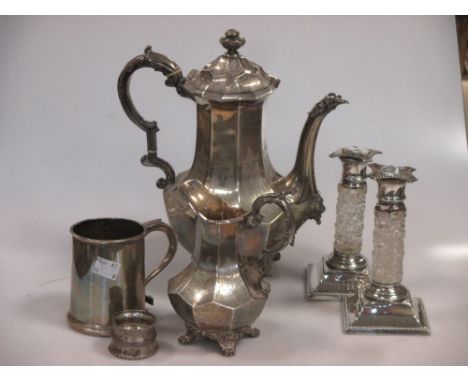 A collection of silver items including a coffee pot and matching cream jug, a tankard, a napkin ring and a pair of silver and