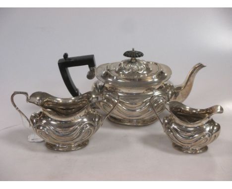 A silver three-piece tea service  