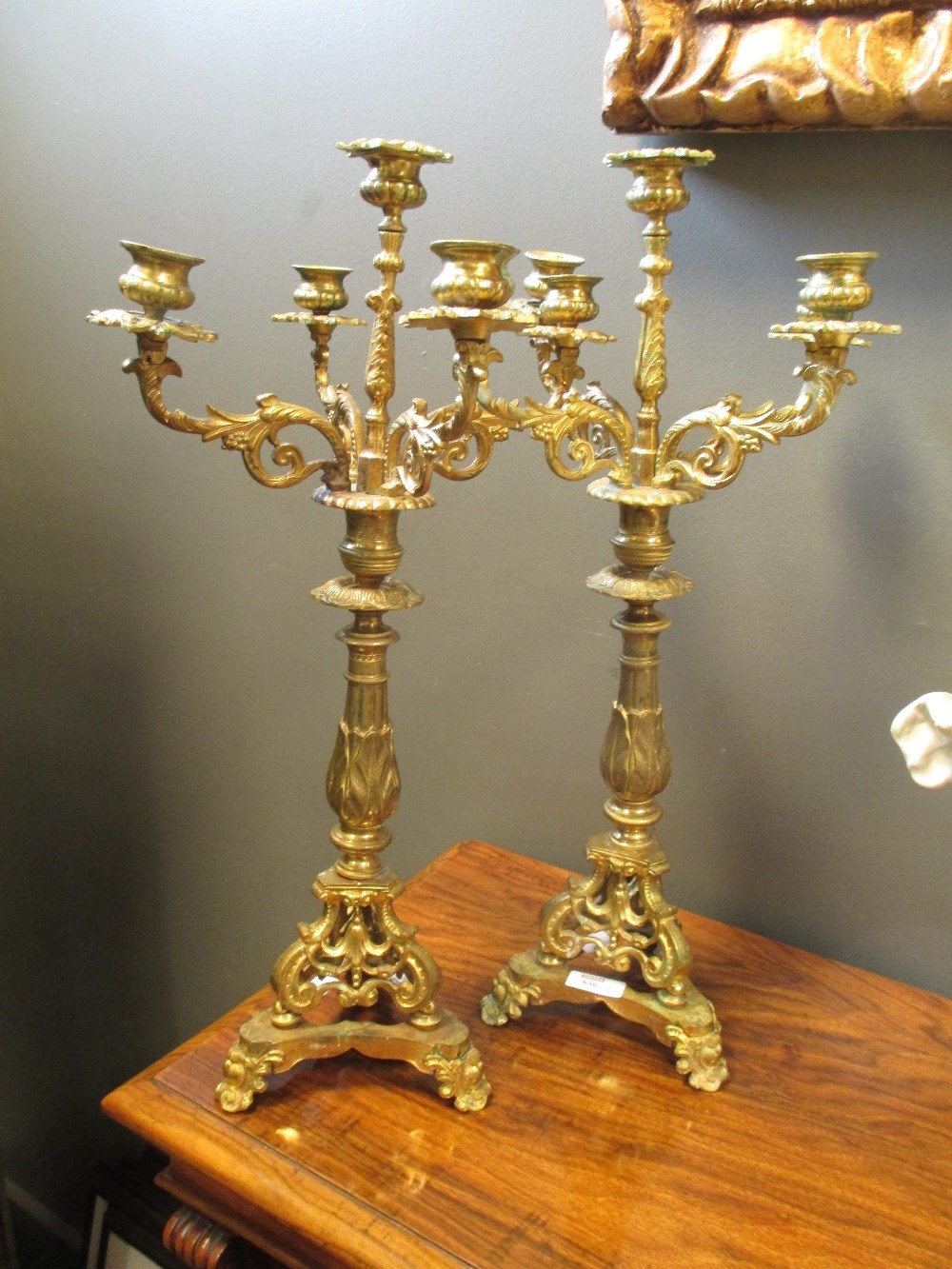 A pair of ornate brass candelabra (2) in Cheffins Fine Art