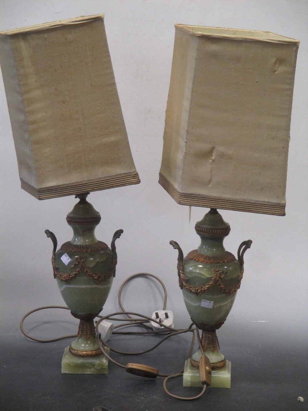A pair of gilt mounted onyx table lamps PAIR OF ONYX GILT METAL MOUNTED TABLE LAMPS