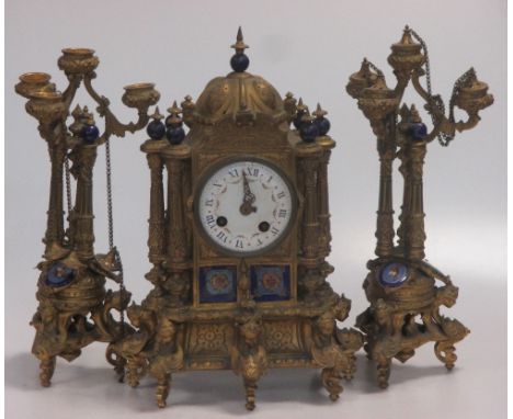 A 19th century gilt metal and enamel three piece clock garniture  