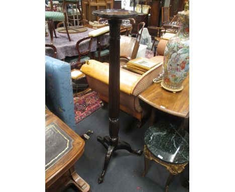 An early 20th Century mahogany tripod torchere with fluted stem, 142cm high  