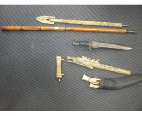A late 19th century Eastern swordstick, a cased bone blow pipe, a WWII USA bayonet etc  