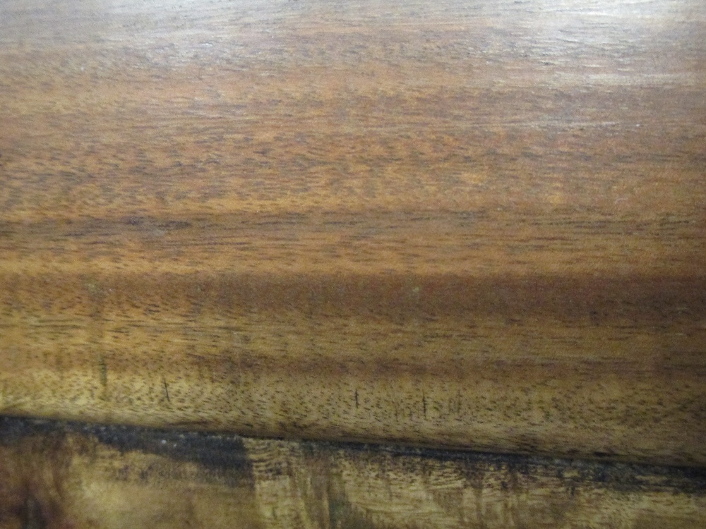 A 20th century Chinese Huanghuali wood Front left leg inner panel is