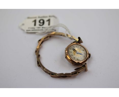 9ct gold cased vintage wristwatch, champagne enamel dial with gilt panel to centre, black Arabic numerals and fancy poker han
