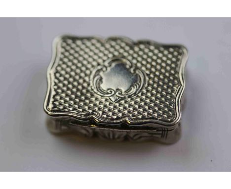 Mid Victorian miniature silver vinaigrette, of rectangular form with pie crust border, engine turned decoration to top and bo