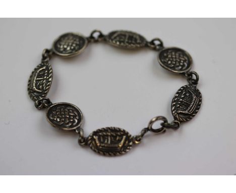 Silver panel bracelet depicting in relief Viking long boats and stylised Celtic knot design in alternate formation, makers Co