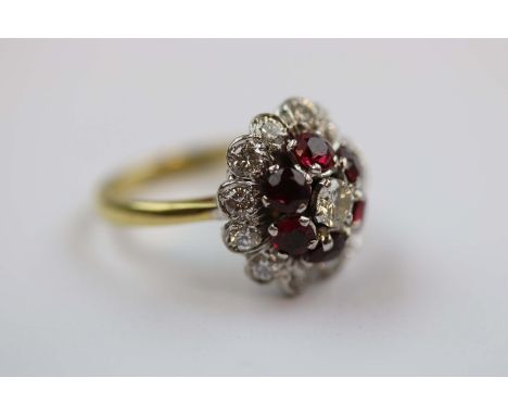 Diamond and ruby 18ct yellow gold platinum set three tier flower head cluster ring, the central round brilliant cut diamond w