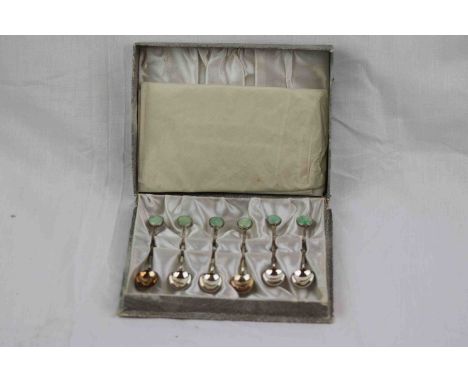 Set of six Hong Kong jade and silver coffee spoons, the finials set with a circular cabochon cut jade stone, rub over setting