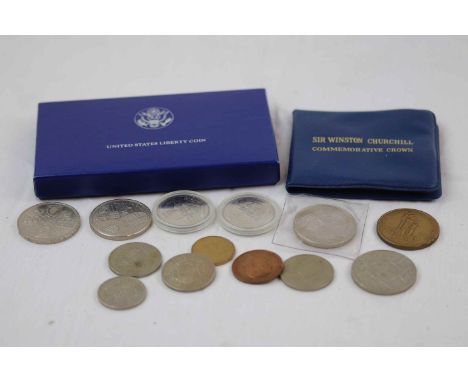 Small collection of vintage coins to include £5 Pound coins and a boxed USA 1986 Silver proof Dollar with COA