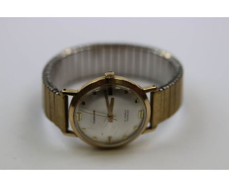 Gents 21 Jewel hallmarked 9ct Gold Wristwatch, marked "Garrard" to the silvered metallic dial with sweep seconds hand and "ET
