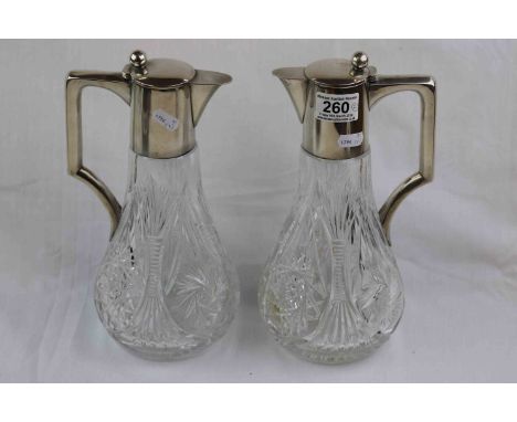 Pair of German silver mounted cut glass claret jugs, plain polished collar, hinged lid and handle, simple ball finial, stampe