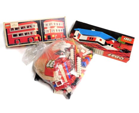 Loose Lego bricks, Lego set 324 and 313, and a reversible tin plate tractor. (4)