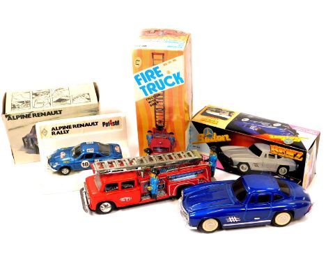 A Metal King tinplate friction fire engine with siren, a Mercedes Benz tinplate friction 300SL Gullwing, and a Polistil Alpin