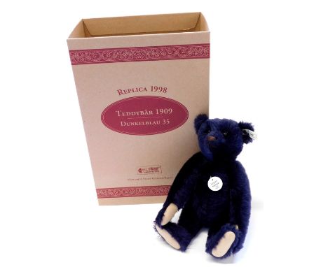 A Steiff Teddy bear, the 1909 replica, in purple fur, boxed.