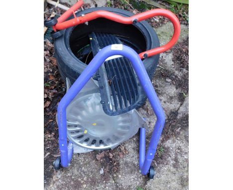 A group of car and automotive parts, to include a Ford alloy, two tyres to include a Evergreen and a Dunlop, a two bike rack 