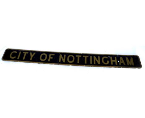 An arched railway engine sign The City of Nottingham, on wooden backing, painted on black ground with gold lettering, 194cm x