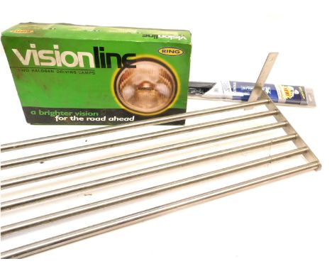 A group of automobilia, comprising a car rack, a pair of Michelin 22" window wipers, and a Ring Vision Line halogen driving l