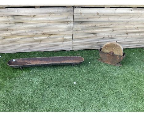Small stone sharpening wheel, and a shallow cast iron trough - THIS LOT IS TO BE COLLECTED BY APPOINTMENT FROM DUGGLEBY STORA