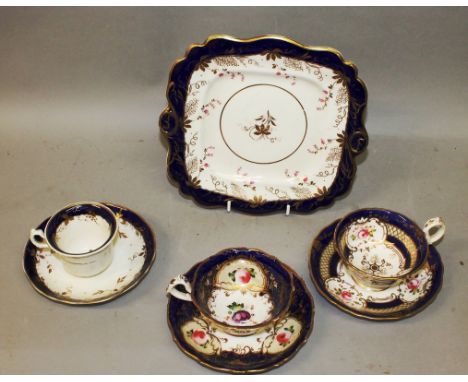 A 19TH CENTURY COALPORT STYLE THREE FLORAL CUPS AND SAUCERS and a floral tray.