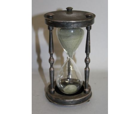 A CHRISTOFLE SILVER PLATE CIRCULAR EGG TIMER.  6ins high.