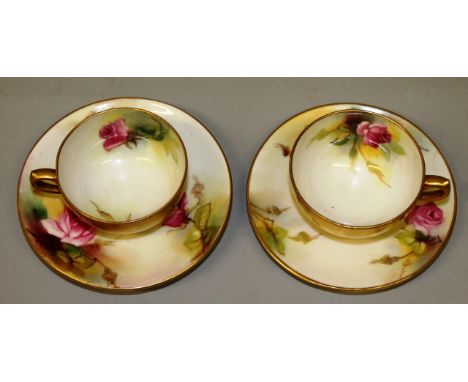 A ROYAL WORCESTER GOOD PAIR OF CUPS AND SAUCERS painted with Hadley style rose, painted and signed by E. (Ethel) Spilsbury, d