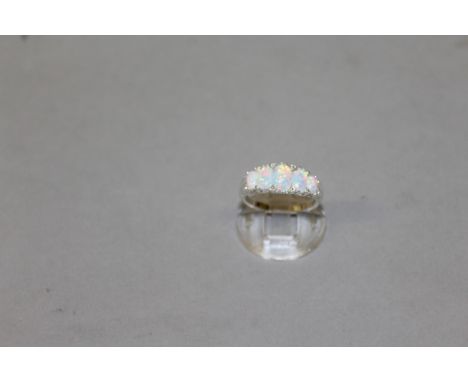 A FIVE STONE OPAL RING.