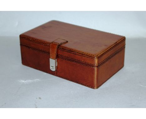 A GOOD SMALL LEATHER TRINKET BOX with magnetic clasp.  8ins wide.