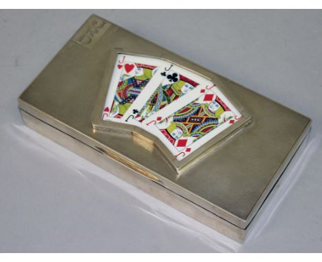 AN ENGINE TURNED AND PLAIN SILVER RECTANGULAR "THREE JACKS" GAMBLING BOX, the lid inset with three Jack playing cards. 17.5cm