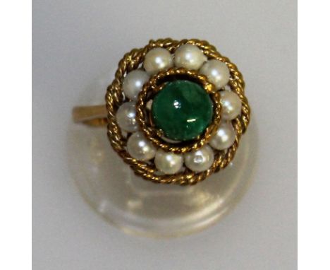 A JADE AND PEARL CLUSTER RING set in gold.