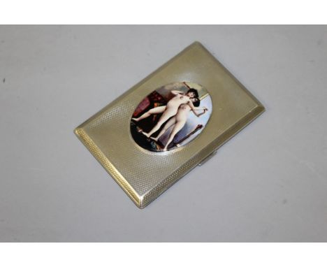 A HEAVY ENGINE TURNED SILVER CIGARETTE CASE, 12cm x 8cm, Chester 1928, with a large oval of two nudes.