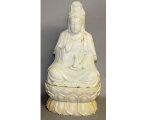 A LARGE CHINESE CARVED WHITE JADE BUDDHA seated on a lotus. 18ins high.