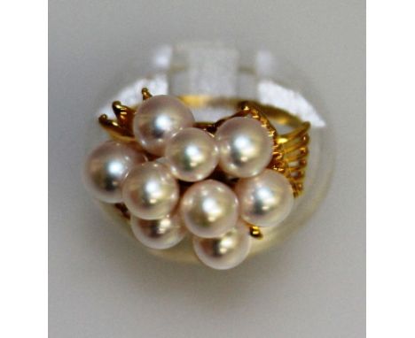 A GOOD GOLD AND FANCY PEARL DRESS RING set with nine pearls.