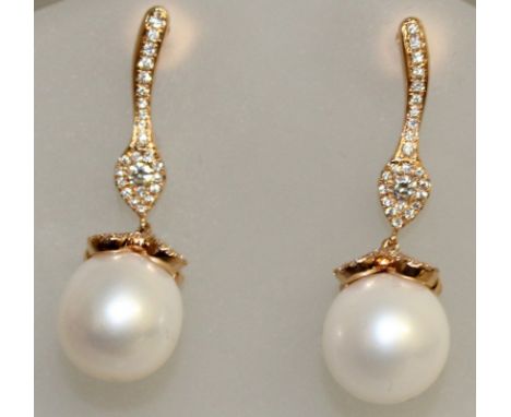 A PAIR OF PEARL AND DIAMOND EARRINGS, set in rose gold.