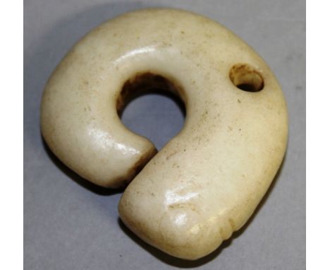 A WHITE JADE PENDANT.  4 x 3.5cm.