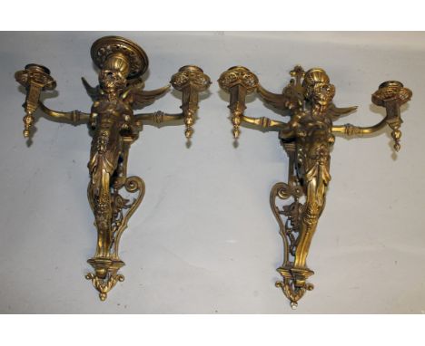 A RARE SET OF SIX 19TH CENTURY BRONZE TRIPLE LIGHT WALL SCONCES with winged classical figure support. Each 19ins long.