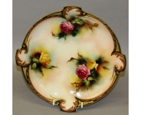 A ROYAL WORCESTER PLATE, finely painted with roses under a coloured clay border in Hadley style, date code for 1907.