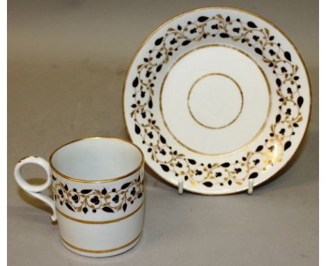 AN EARLY 19TH CENTURY FLIGHT BARR WORCESTER COFFEE CAN AND SAUCER with trailing brown and gilt vines, a Flight Worcester shan