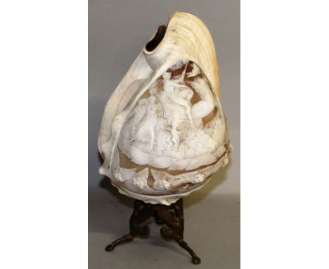 A GOOD LARGE VICTORIAN CARVED CAMEO SHELL, converted to a lamp with chariot and cupids. Shell: 9ins long, on a gilt base.