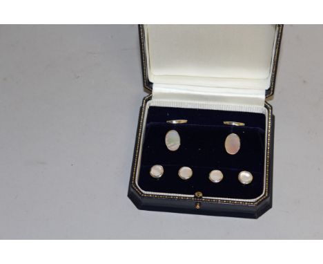 A CASED MOTHER-OF-PEARL AND STERLING SILVER STUD SET.