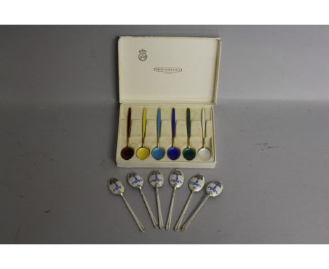 A SET OF SIX .925 SILVER AND ENAMEL NORWEGIAN SPOONS, David Andersen, in a box and A SET OF SIX COFFEE SPOONS.