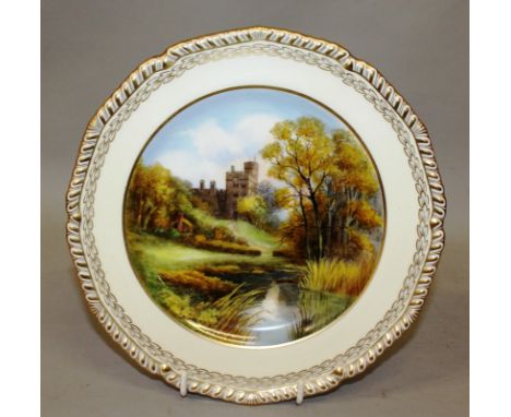 A 20TH CENTURY ROYAL CROWN DERBY PLATE, painted with a view of Haddon Hall by D. Hague, signed and a Copeland Spode plate pai