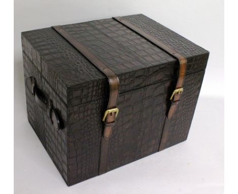 A FAUX CROCODILE LEATHER SMALL TRAVELLING TRUNK, with buckled straps and carrying handles. 1ft 4ins wide x 1ft 0ins deep x 1f