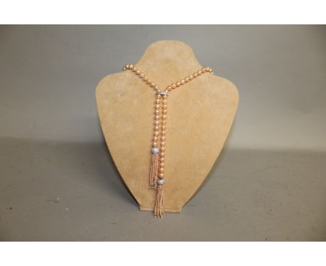 A FRESHWATER PEARL NECKLACE OF NATURAL PINK COLOUR, set with crystals and tassel decoration.