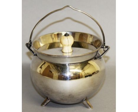 A CHRISTOPHER DRESSER ROUND CAULDRON with swing handle, lid with ivory finial, on three curving legs. CIRCA 1885 by ELKINGTON