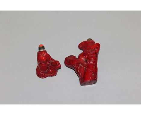TWO CHINESE RED CORAL SNUFF BOTTLES & STOPPERS, each carved in the form of Budai and a tree trunk, 3in & 1.6in high. (2)