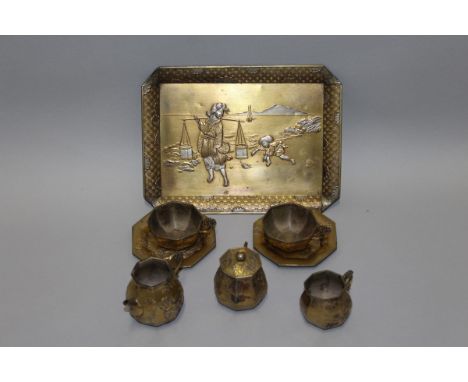AN EARLY 20TH CENTURY JAPANESE GILDED & SILVERED SOFT METAL MINIATURE PART TEA SERVICE, comprising a tray, a teapot, a sugar 