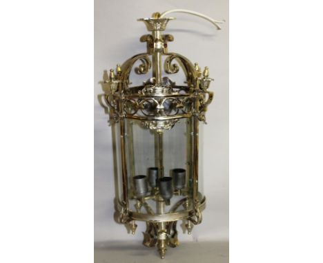AN ORNATE GLASS AND PLATED CIRCULAR HALL LANTERN. 2ft 3ins high.