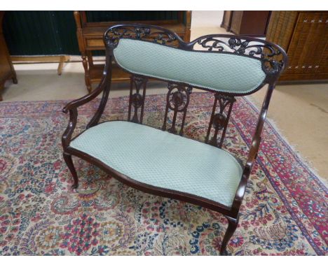 Unusual Mahogany framed two seater hall bench with green upholstered seats. With shaped top, carved fruit fretwork decoration