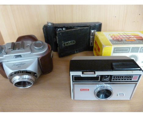 KodaK No1 pocket camera along with an original in box and packagain Kodak instamatic camera and a Hunter camera in leather ca